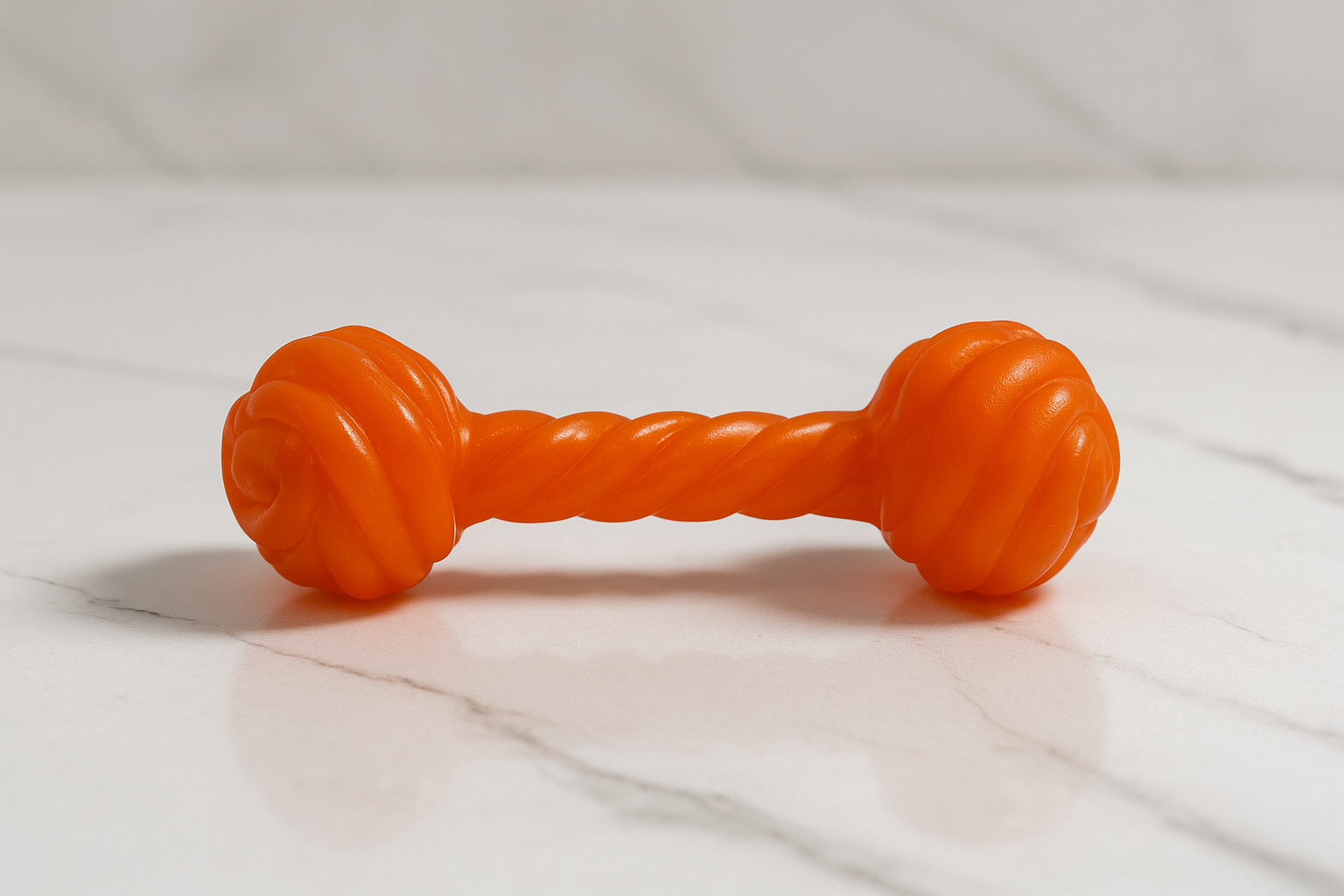 Orange Chew Toy on Marble